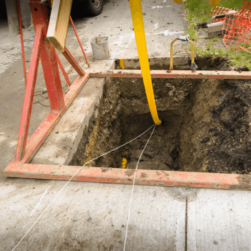 Image of an underground gas line with a concrete cut