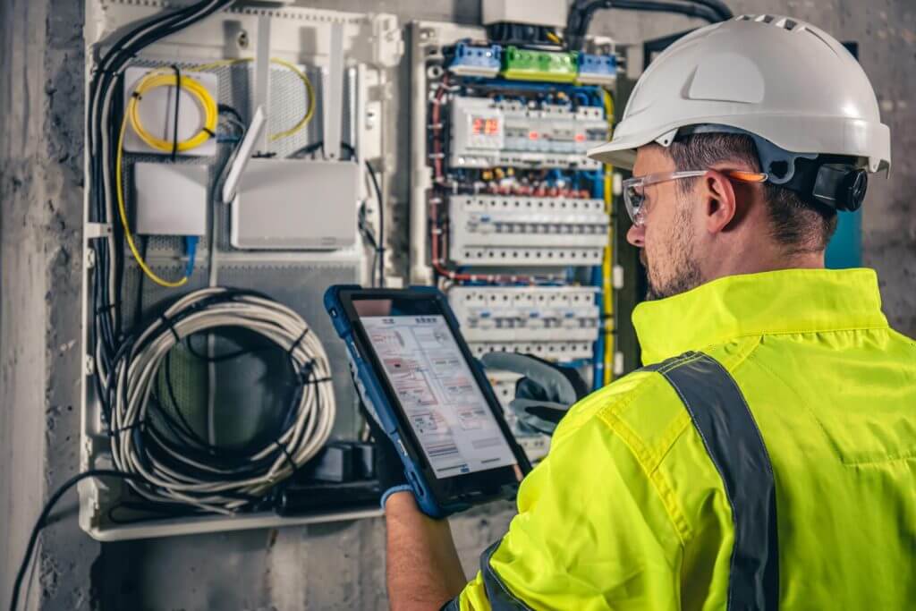 Expert using equipment to prevent service disruptions.